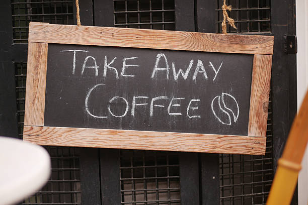 istock Sample chalkboard advertising takeaway coffee at cafe in city 2216692507