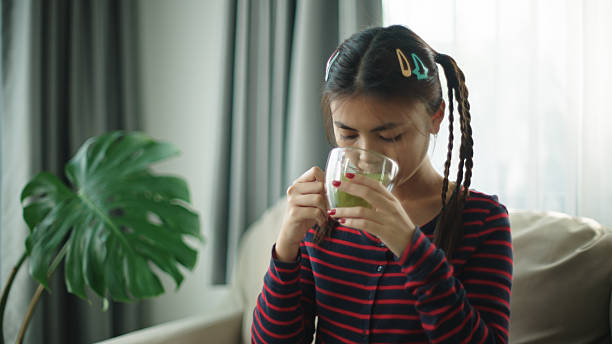 istock Teenager drinking matcha hot tea. 2216692723