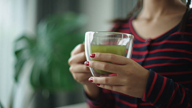 istock Teenager drinking matcha hot tea. 2216692727
