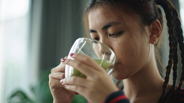 istock Teenager drinking matcha hot tea. 2216692749