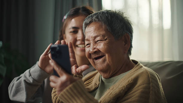 istock Senior and teenager making a video call. 2216693897