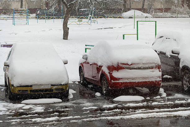 istock Heavy snowfall covers cars in spring amid climate change worries 2216695572