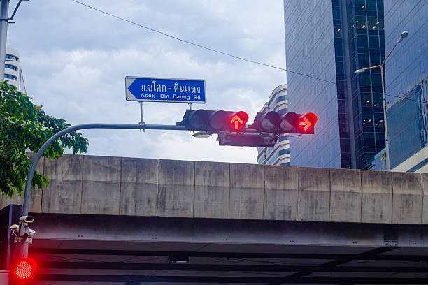 istock Red stop lights and traffic arrows 2216698991