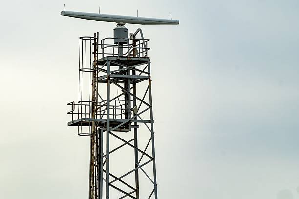 istock Rotating radar antenna scanning the sky on metal tower 2216700542