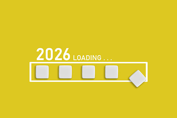 istock 2026 Loading text on Yellow backdrop. Ideal for business planning, financial trends, and future economic concepts 2216701803