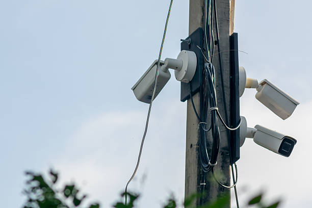 istock Security Cameras Installed on Utility Pole Outdoors 2216705072