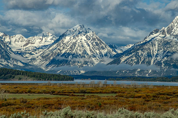 View of lake, meadows and mountains where wildlife is abundant at Grand Teton National Park, Wyoming, United States.