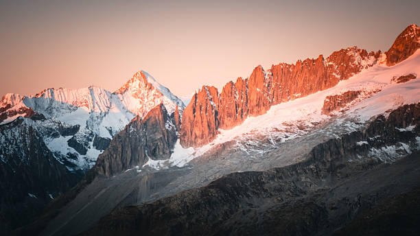 istock Sunrise over snowcapped mountain and glaciers 2216710455