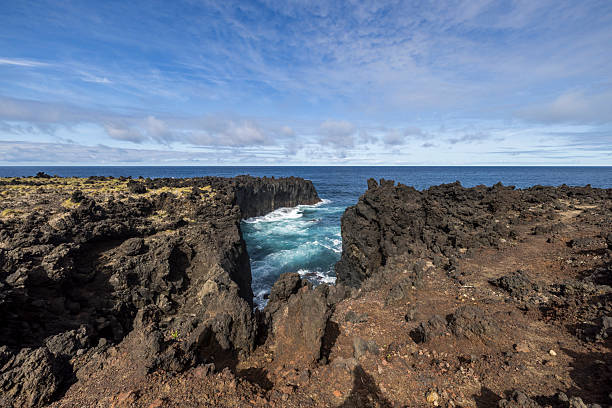 rough volcanic lava atlantic ocean coastline, azores islands, portugal.