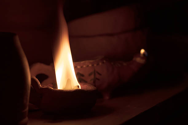 istock A candle is lit in a dark room 2216716651