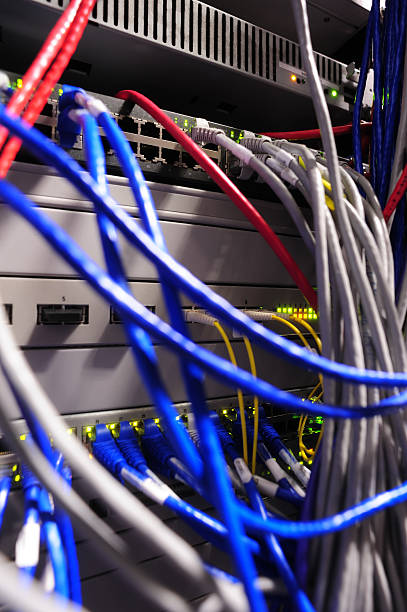 istock Close-up of Network Servers Rack with Data Cables in Data Center 2216720662