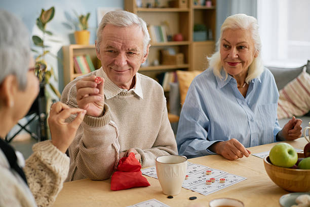 istock Seniors Enjoying Board Game Gathering With Friends 2216721874