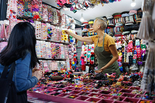 istock Friendly Shopping Experience at Hair Accessory Stall 2216725230