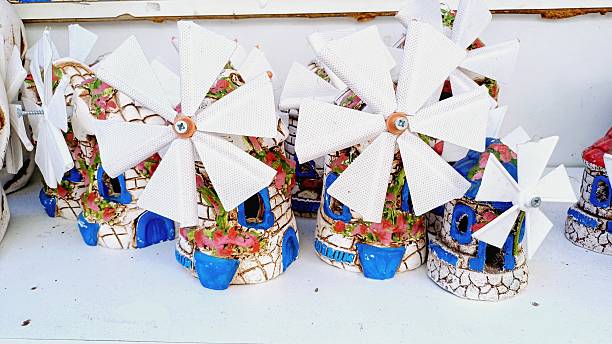 ESG concept with wind turbine paper on yellow background. (3d render)
