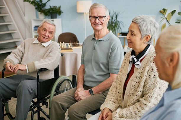 istock Seniors Having Conversation in Retirement Home Common Area 2216726810