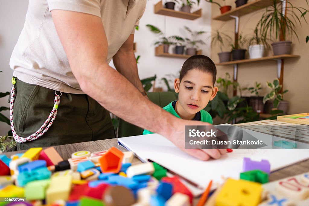Father Autism Father Guiding Autistic Son Through Drawing Stock Photo - Download ...