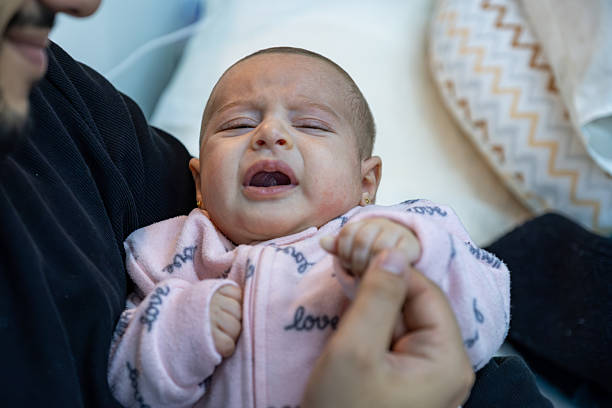 istock Close-Up of a Crying Baby Showing Emotion and Vulnerability 2216728032