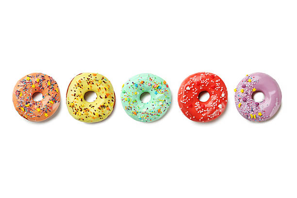 istock Collage of donuts with sprinkles on a white background 2216730556