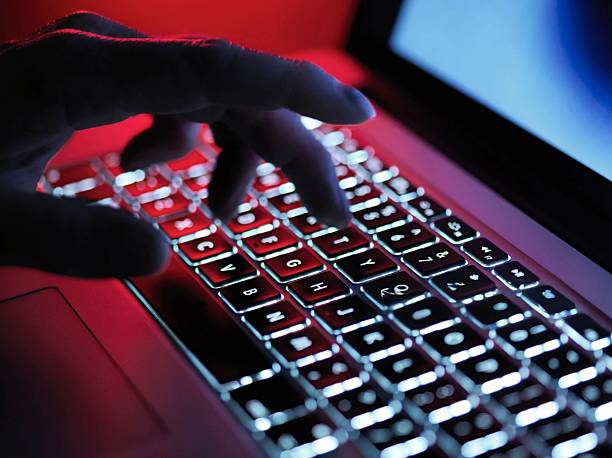 istock A hand delicately types on a laptop's illuminated keyboard, creating a digital connection. 2216731334