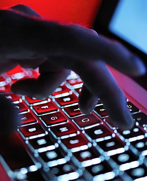 istock A hand delicately types on a laptop's illuminated keyboard, creating a digital connection. 2216731380