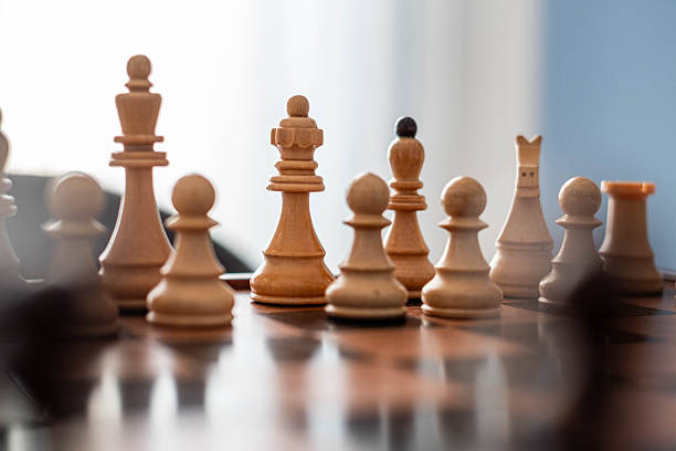 istock wooden chess and chess pieces 2216733138