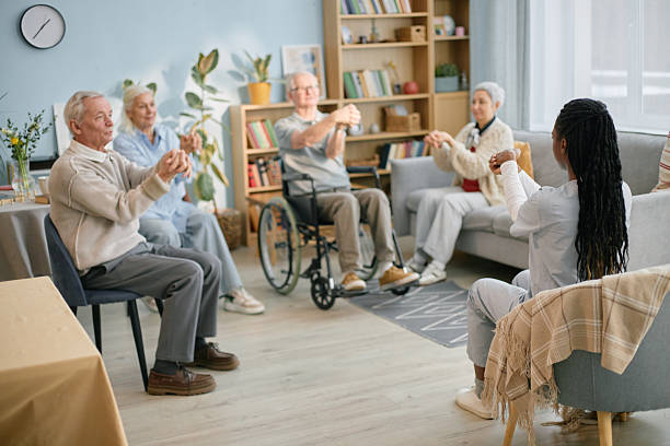 istock Engaging Seniors in Group Chair Exercise Activity 2216733287