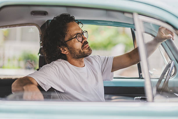 istock Man in his car in the city 2216733488