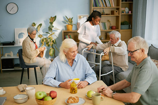 istock Elderly People Engaging in Social Activities at Facility 2216733952