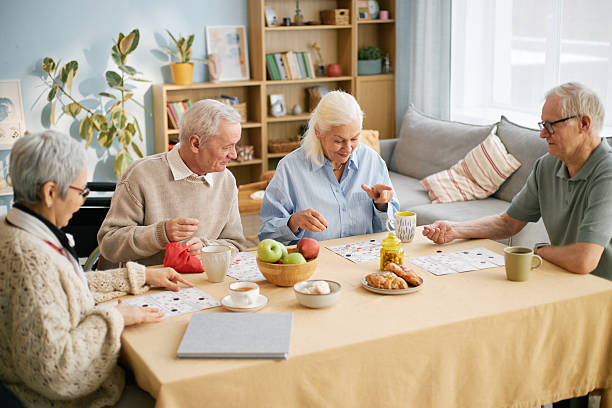 istock Group of Elderly People Enjoying Breakfast Together 2216735047