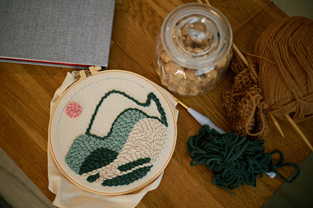 istock Embroidering Design on Fabric with Yarn and Tools 2216736039