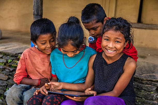 istock Nepali children using digital tablet near Annapurna Range 2216736442