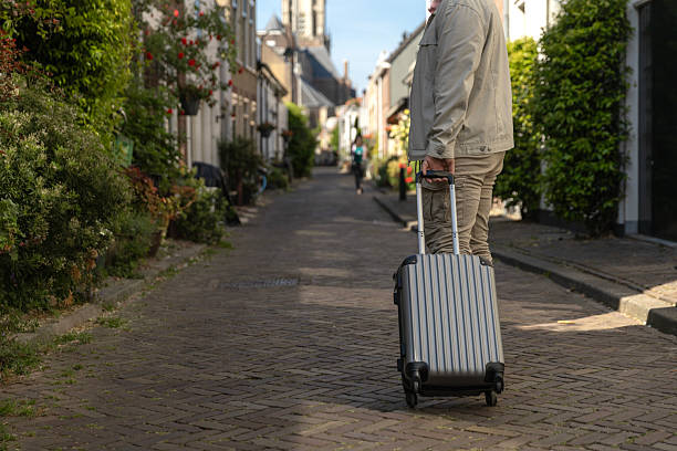 istock Handsome senior man walking through Delft whilst on a coastal vacation 2216737688