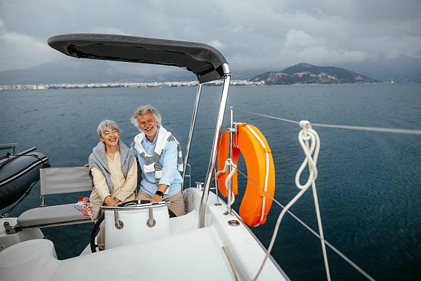 istock Senior couple casually sailing a catamaran together 2216739399