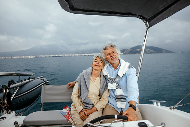 istock Senior couple casually sailing a catamaran together 2216739406