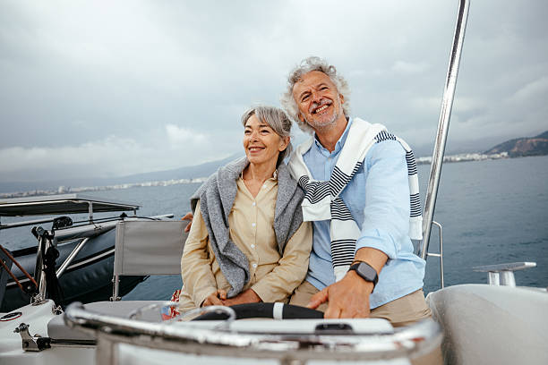 istock Senior couple casually sailing a catamaran together 2216739419