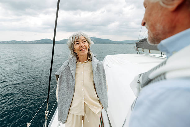istock Senior couple talking together on yacht deck 2216739601