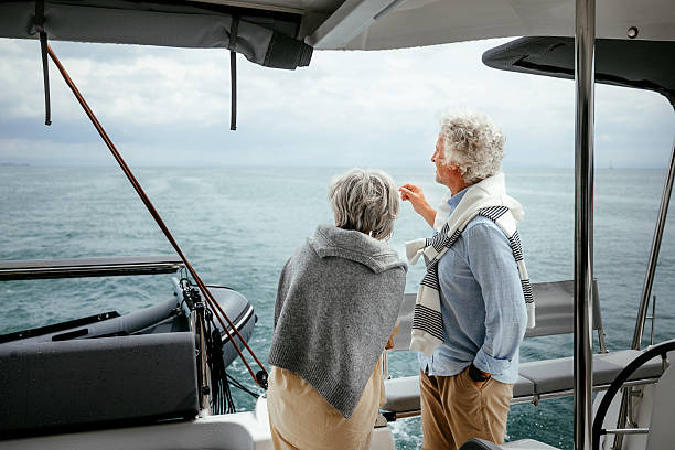 istock Senior couple enjoying a quiet conversation on yacht 2216739633