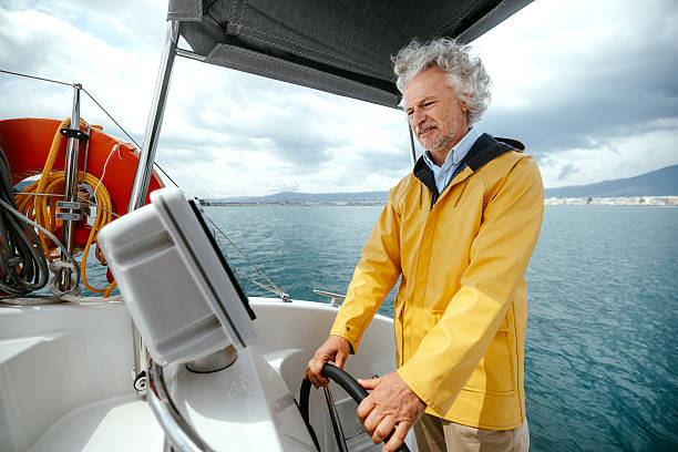 istock Senior boat captain sailing catamaran 2216739665