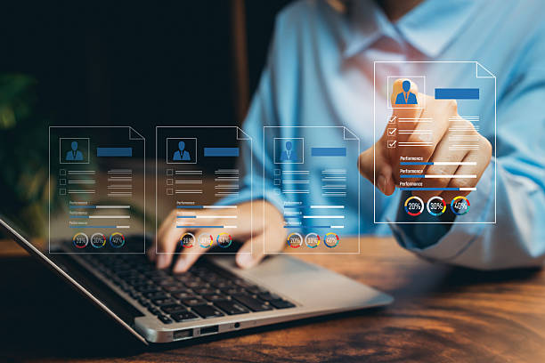 istock Professional Person Analyzing Digital Resumes with Modern Laptop and Graphic Visualization of Job Applications, Business concept 2216740950