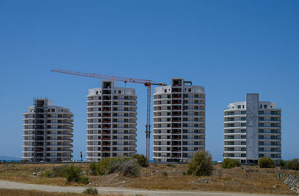 istock Urban construction site with a tower crane and multi-story building under development in Cyprus. 2216741738