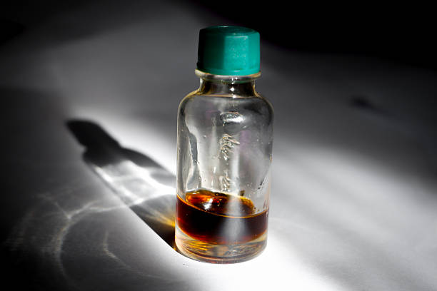 istock Massage Oil in Glass Bottle with Dramatic Lighting 2216746848