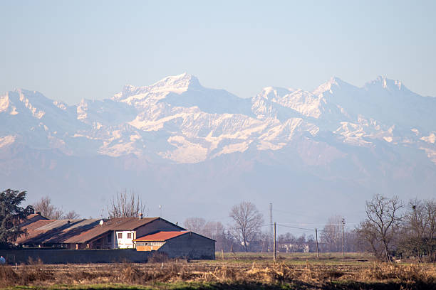 istock Scenic Mountain Landscape With Snowy Peaks And Rustic Countryside 2216748101