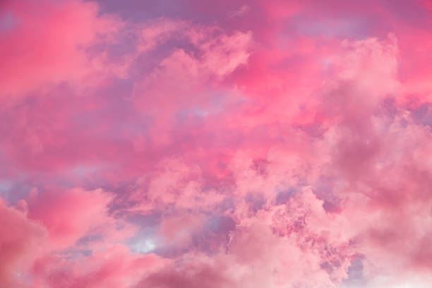 istock Fairytale sky with sugar cotton pink clouds in a dreamy background. Fantasy environment. Amazing heaven. Nature wallpaper. Idyllic backdrop. Romantic atmosphere. Textured abstract. High quality photo 2216754039