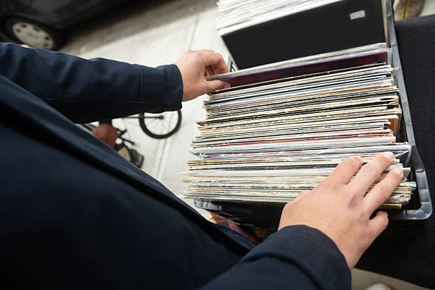 istock Man Looking Through Records at a Spring Sidewalk Sale in NYC 2216764146