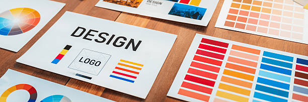 istock Various color palette idea papers arranged on workspace for designer. Scrutinize 2216768417