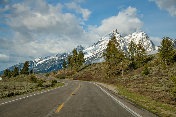 istock Grand Teton road and mountain peaks on rainy spring day 2216772076