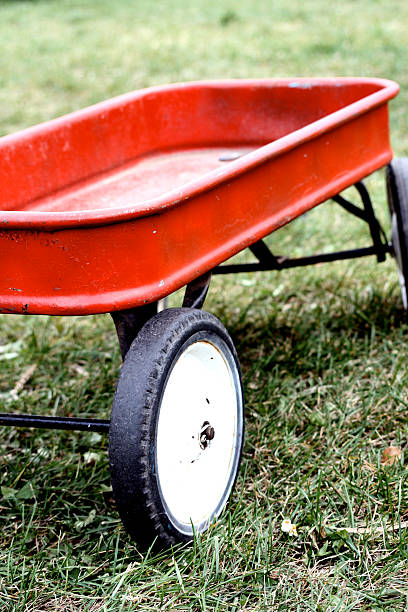 istock Vintage Red Wagon on Grass 2216777260