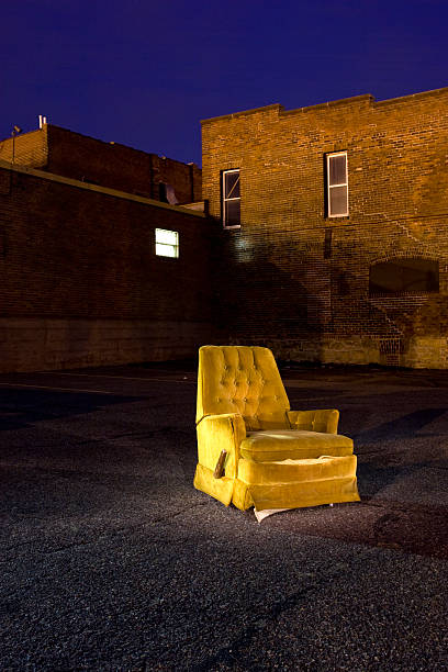 istock Vintage Armchair in Empty Parking Lot at Night 2216777415