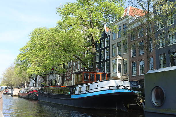 Typical canal view with house boats in Amsterdam