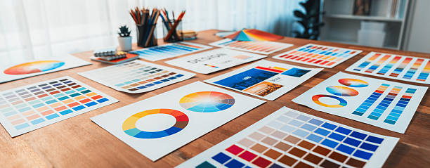 istock Various color palette idea papers arranged on workspace for designer. Scrutinize 2216781442